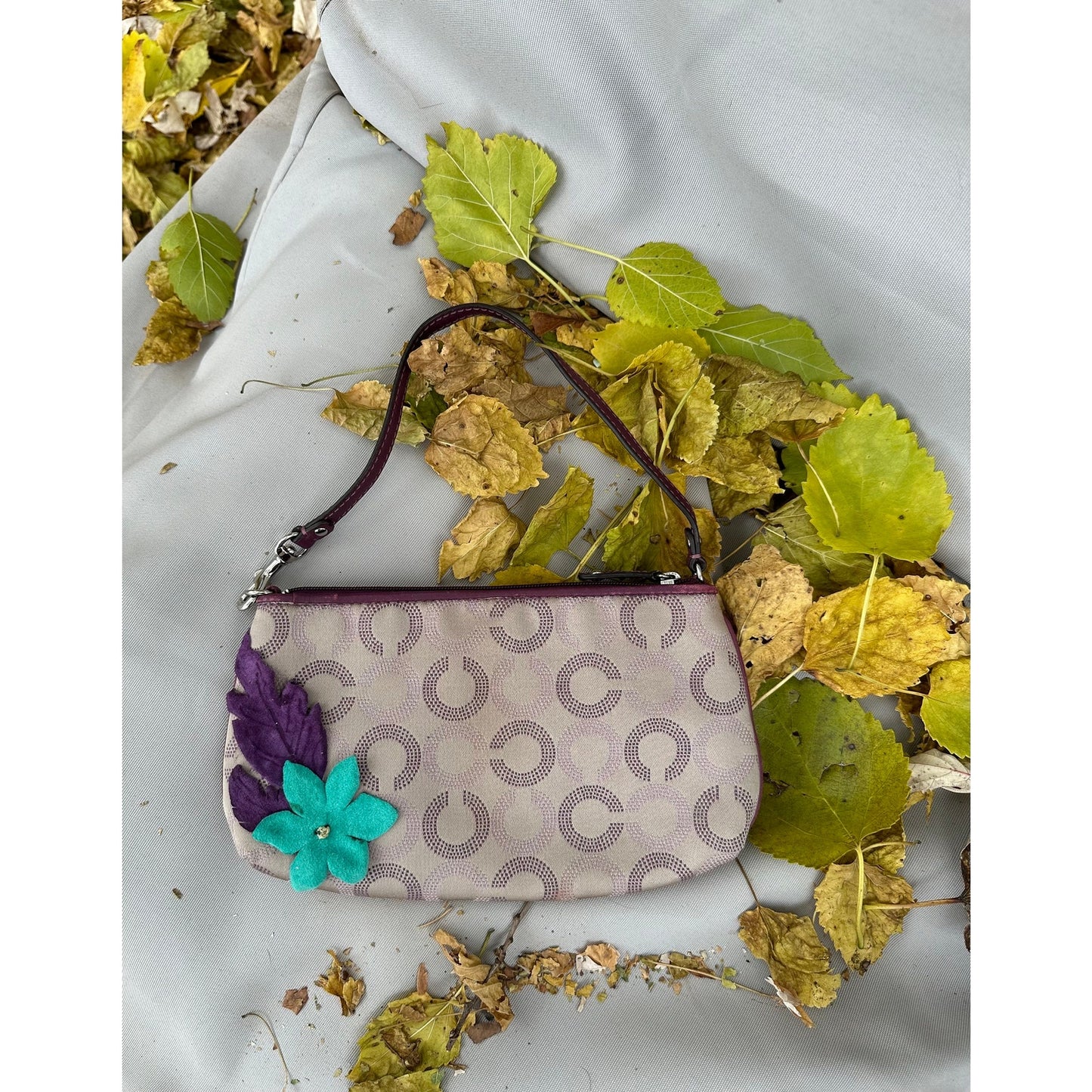Coach Wristlet with suede flowers. Upstyled . 9.25 × 5.5