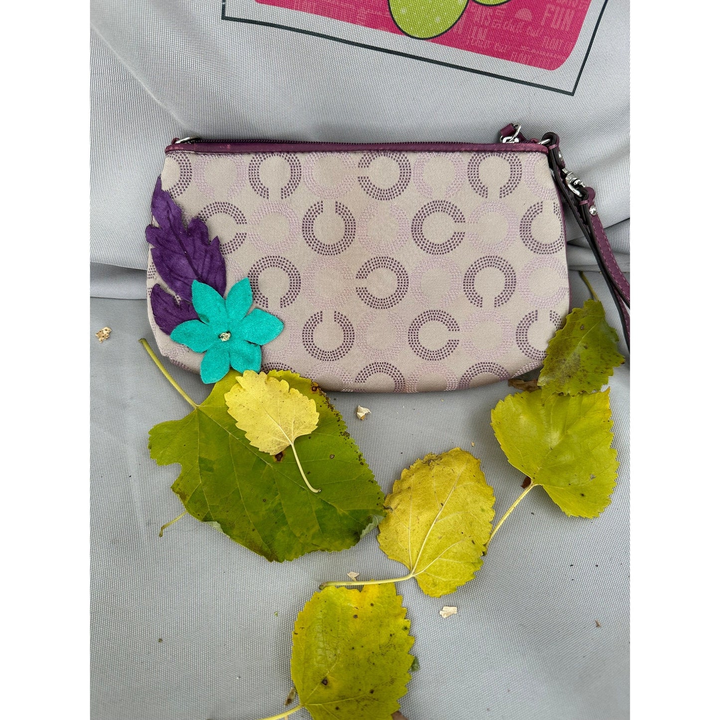 Coach Wristlet with suede flowers. Upstyled . 9.25 × 5.5