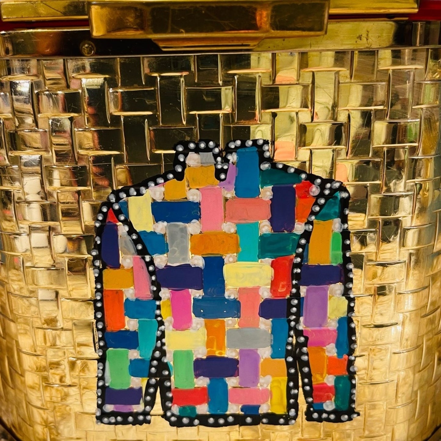 lucite purse in gold basketweave with lucite handles and top lid.