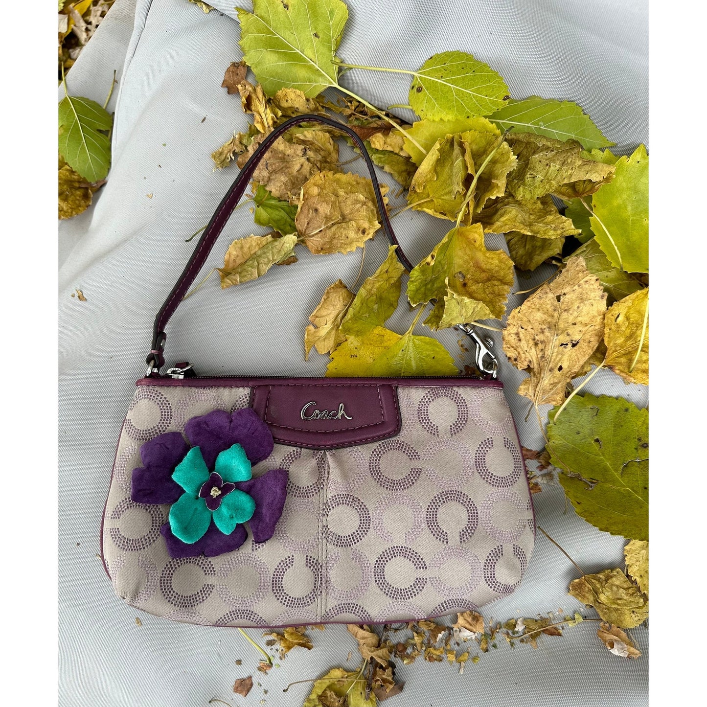 Coach Wristlet with suede flowers. Upstyled . 9.25 × 5.5