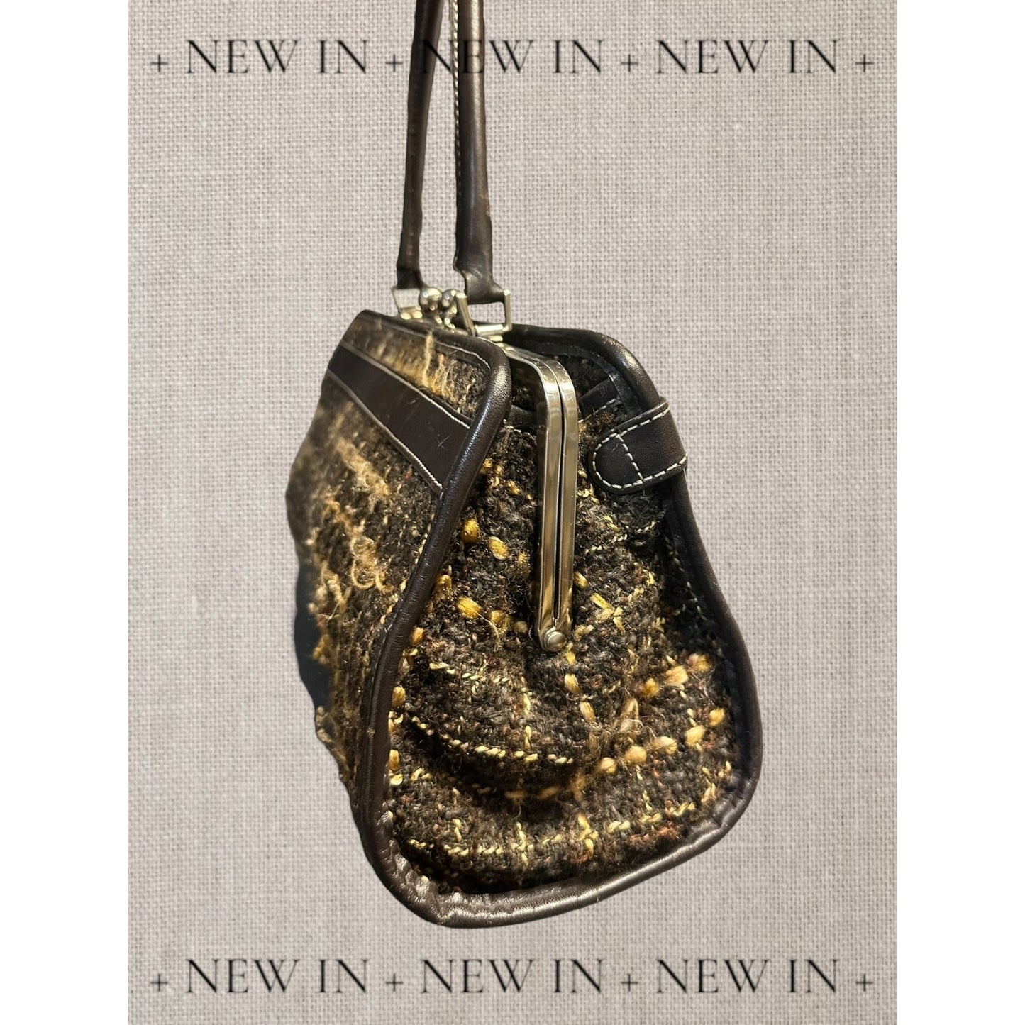 Jones New York leather lambswool and man made elements and a helmet embellished on a canvas appliqué.