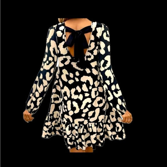 Black cream print dress with ruffle bottom and black ribbon tying the back 8/10
