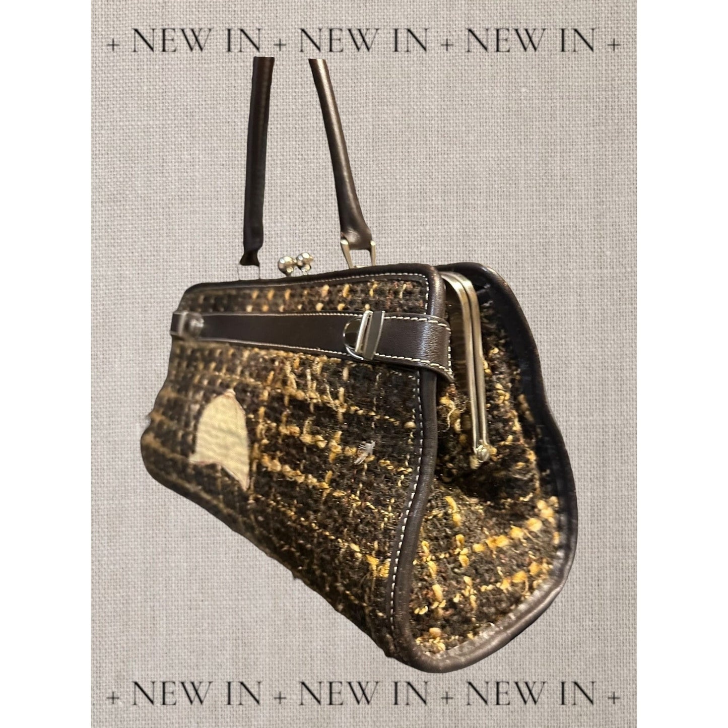 Jones New York leather lambswool and man made elements and a helmet embellished on a canvas appliqué.