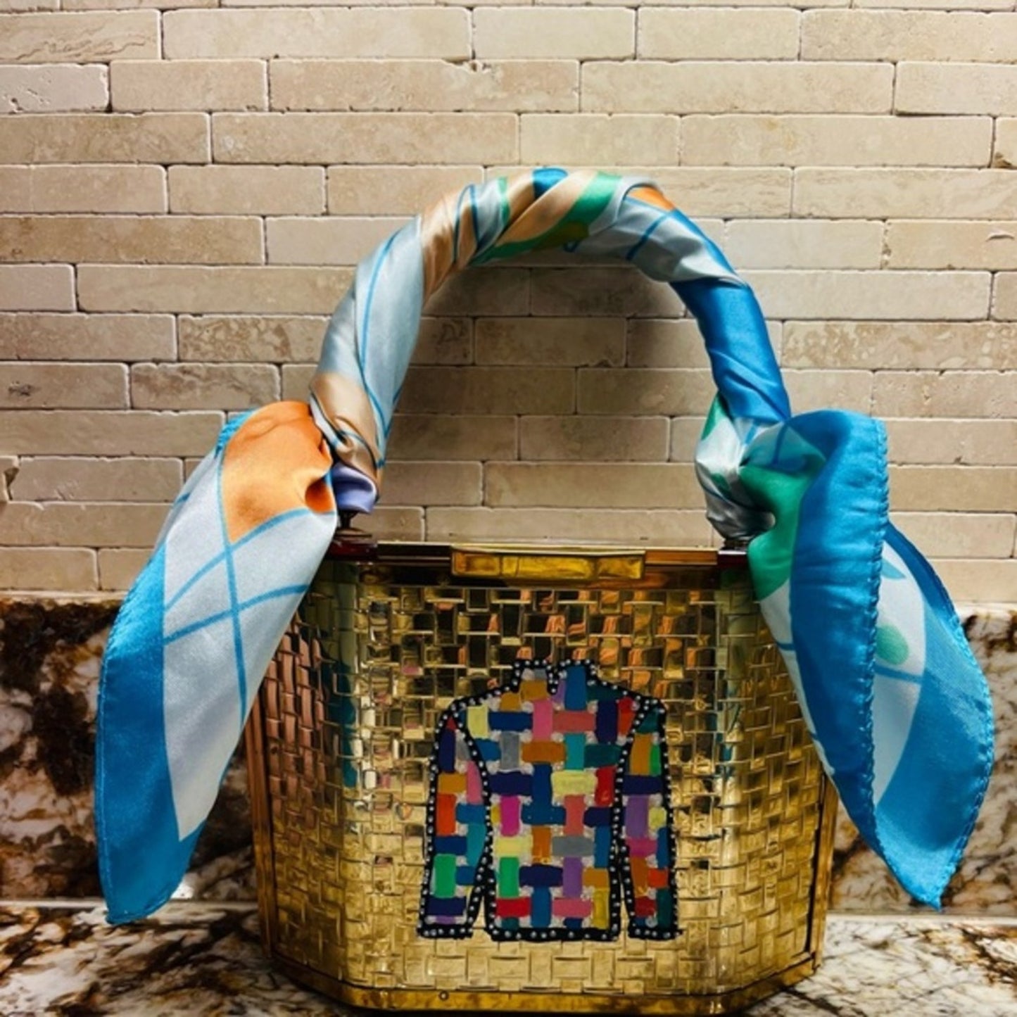 lucite purse in gold basketweave with lucite handles and top lid.