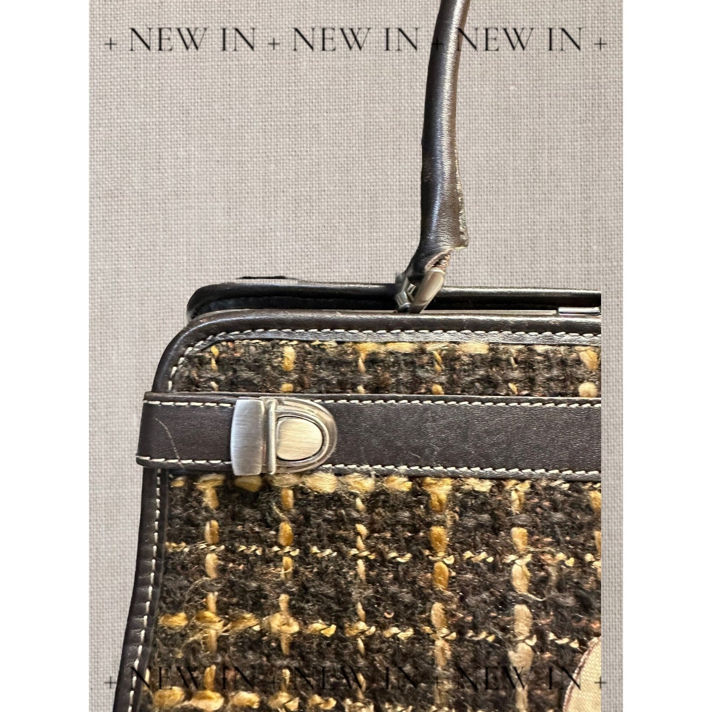 Jones New York leather lambswool and man made elements and a helmet embellished on a canvas appliqué.