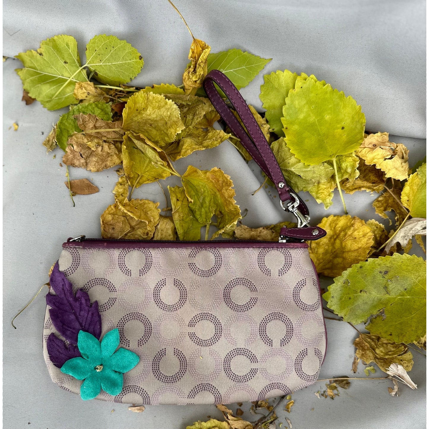 Coach Wristlet with suede flowers. Upstyled . 9.25 × 5.5