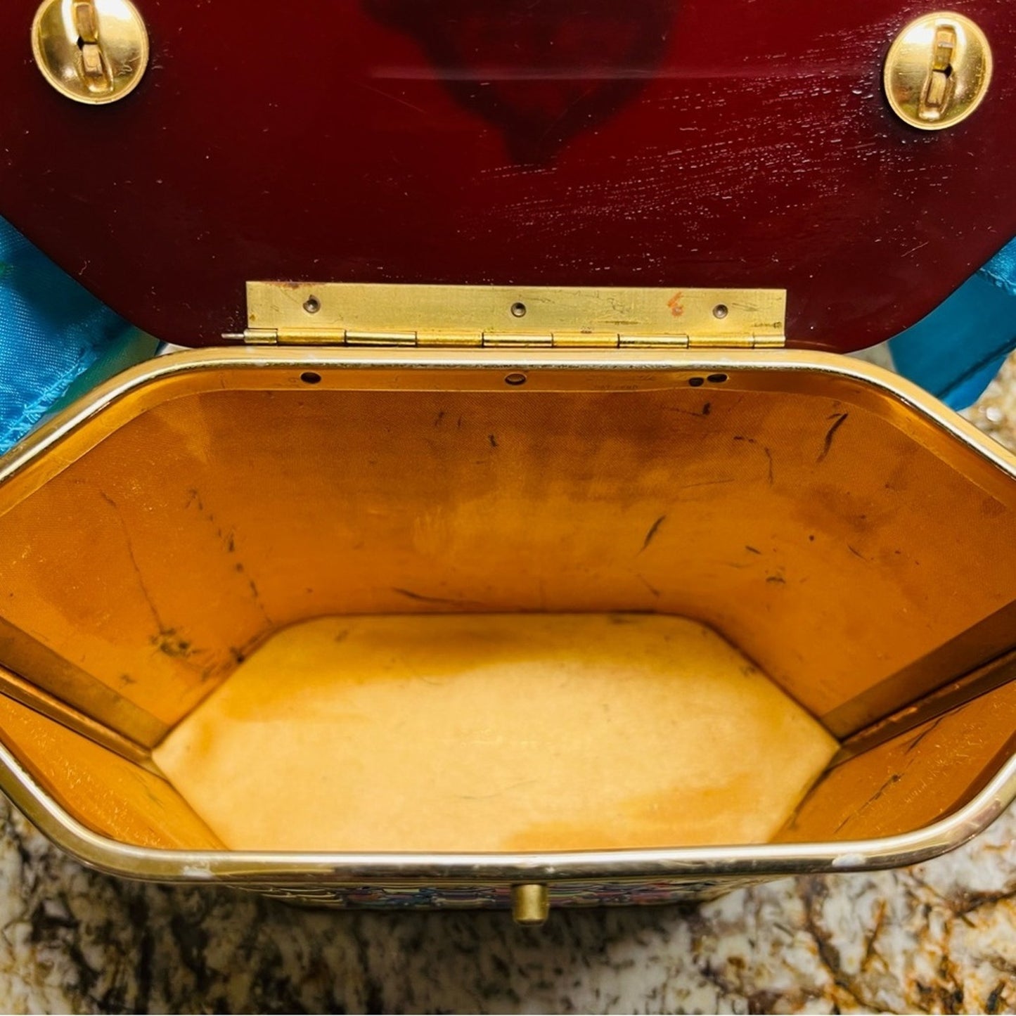 lucite purse in gold basketweave with lucite handles and top lid.