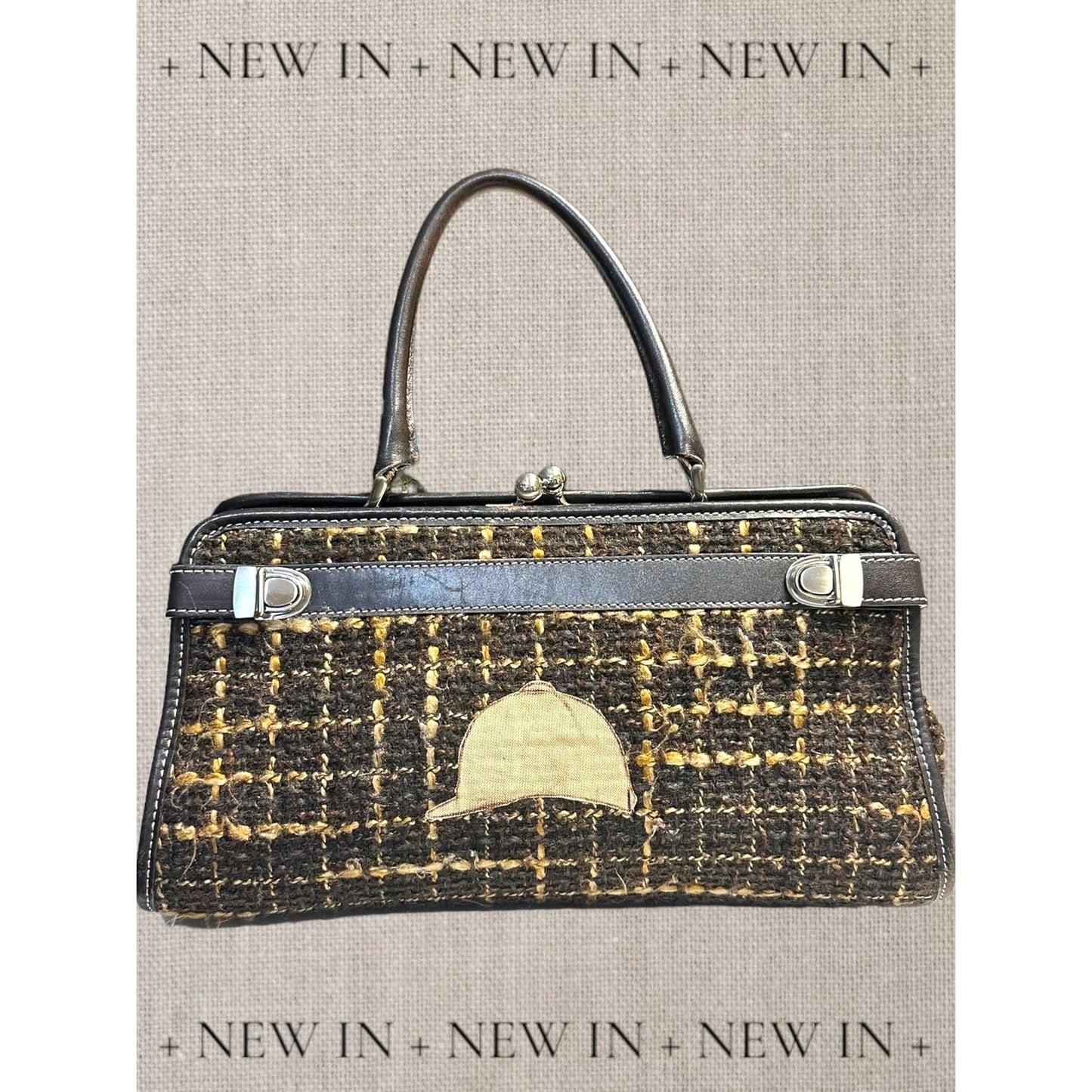 Jones New York leather lambswool and man made elements and a helmet embellished on a canvas appliqué.