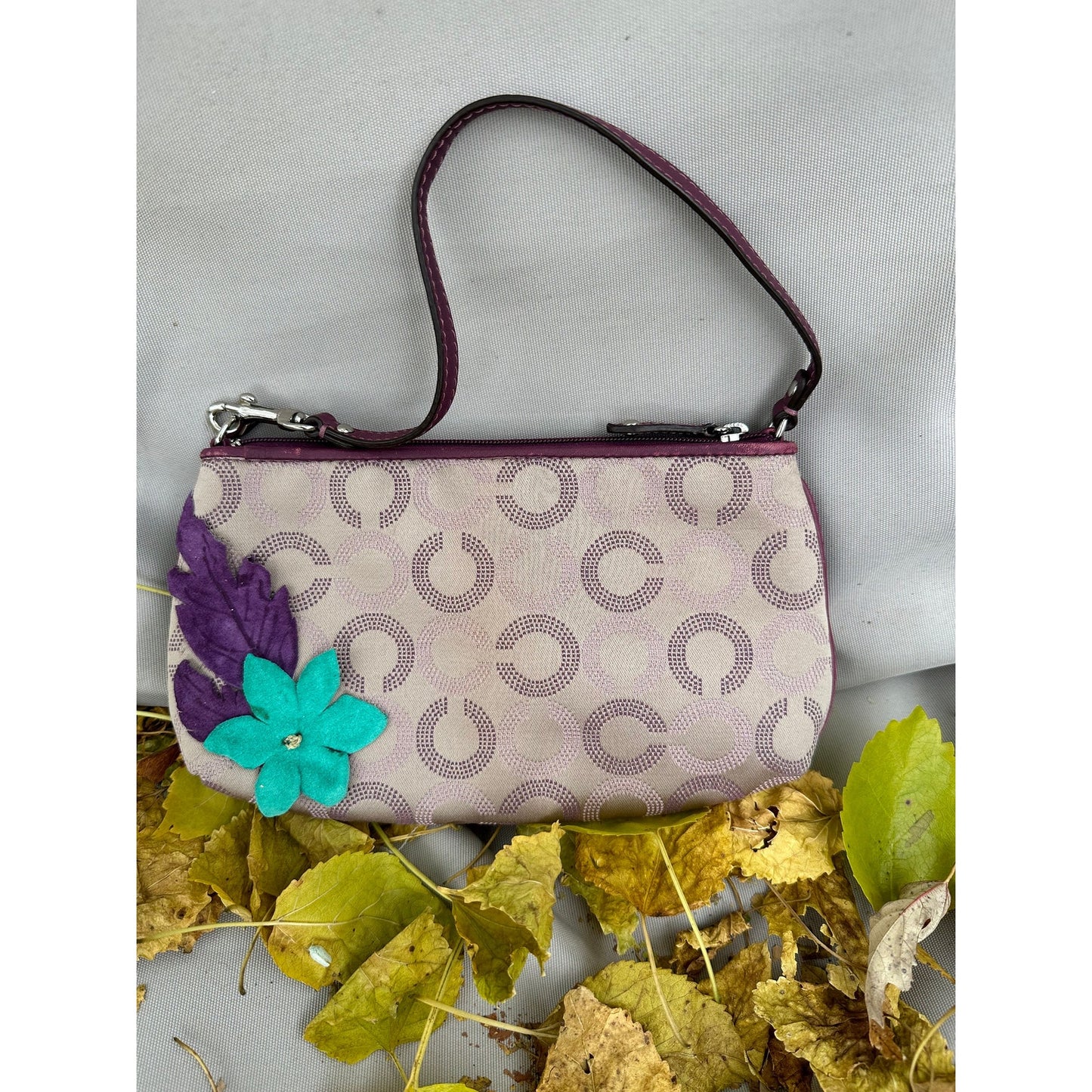 Coach Wristlet with suede flowers. Upstyled . 9.25 × 5.5