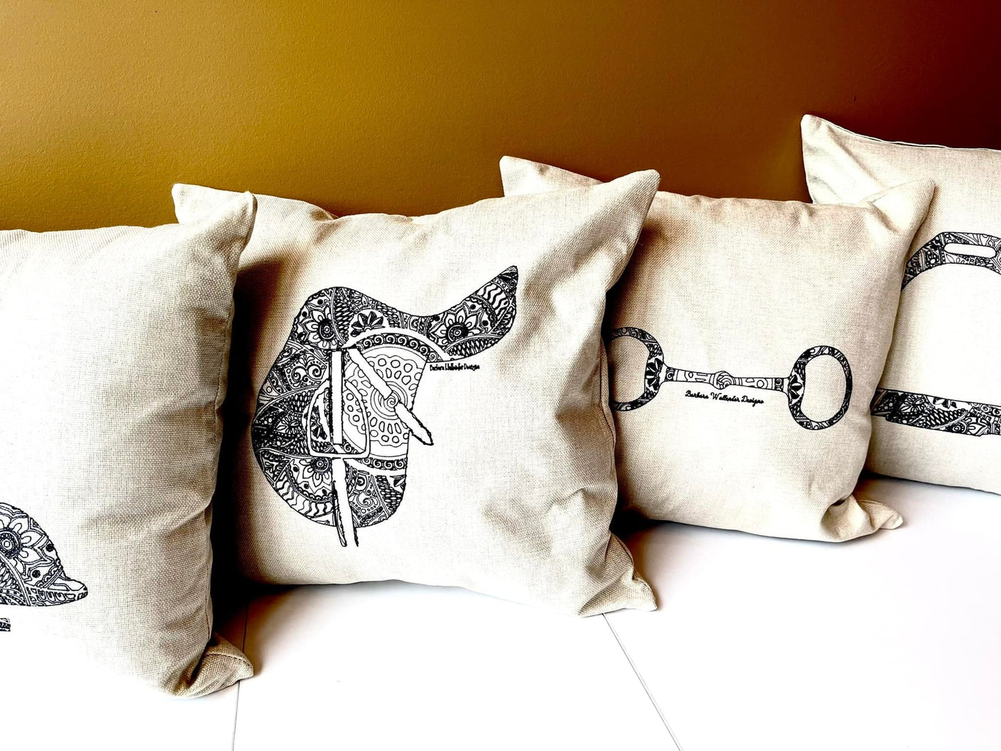 The Chin Up Collection Throw Pillows featuring a saddle, bit, irons, boots & helmet motif on cover only linen blend.