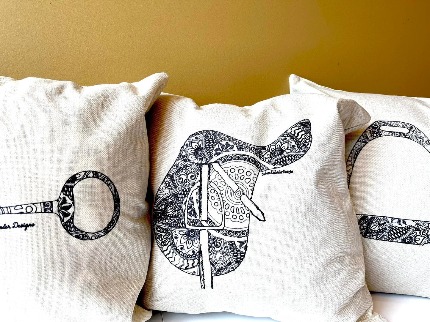 The Chin Up Collection Throw Pillows featuring a saddle, bit, irons, boots & helmet motif on cover only linen blend.